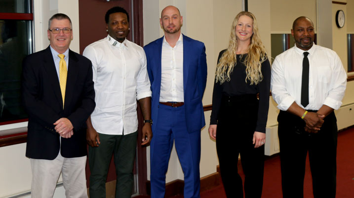 Cecil College Athletic Director Ed Durham stands with the Class of 2024 Jerome Coleman, Eric Schmieder, Katie (Ferguson) Giffing, and Bill Dorsey. Missing are Aaron Lewis, Don Feldscher, and