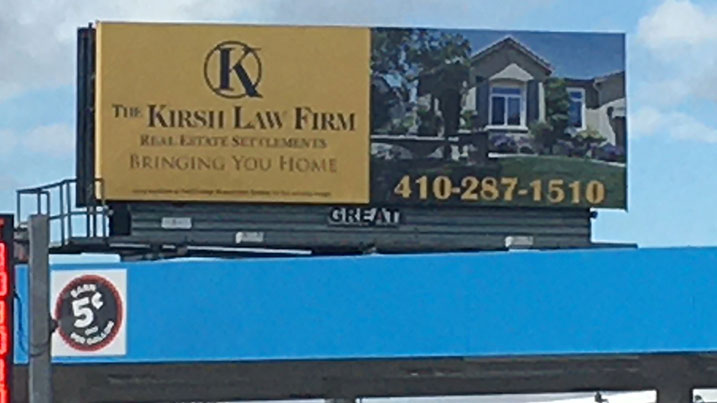 A billboard for The Kirsh Law Firm.