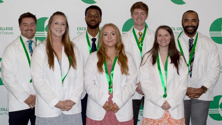 The Cecil College Class of 2025 Physical Therapist Assistant (PTA) graduates are: Front (L to R) - Alexa Mitros, Harley Grevera, and Jenna House. Back – Joseph Denver, Darius Johnson, Philip Martin, and Lamont Washington.