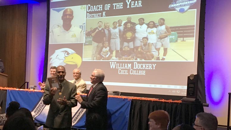 This is a photo of William Dockery receiving his Coach of the Year award