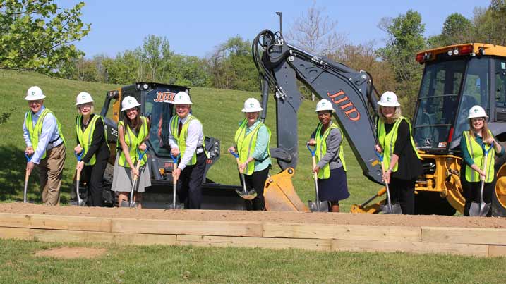 This image shows the ground breaking for the new entrance and the facilities maintenance b building. The people in the image are college and county officials.