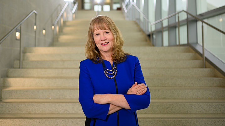 Cecil College President Mary Way Bolt, Ed.D., standing at the bottom of the stairs in the Engineering and Math Building on the North East Campus of Cecil College.