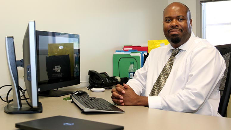 Maurice Tyler at his desk