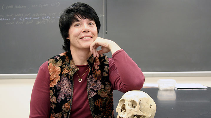 Nancy Vinton sitting in her classroom.