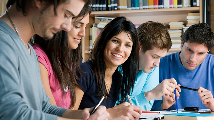 Adult students in a classroom setting.