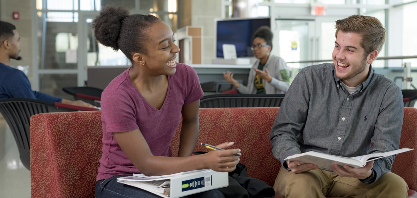 Two students laughing.