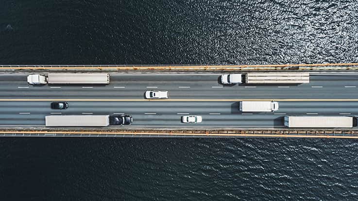 Vehicles traveling on a road.