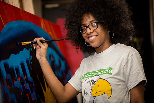 An art student working on a painting.