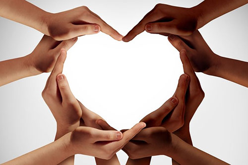 Hands forming a heart shape.