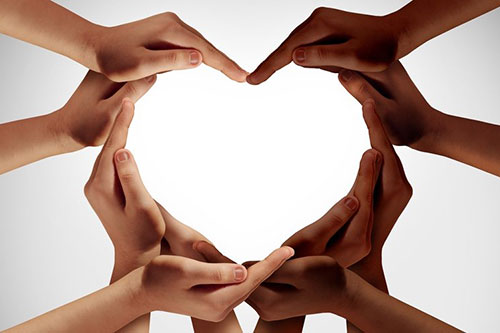 Hands creating the shape of a heart.