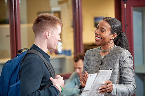 Student talking with an advisor.