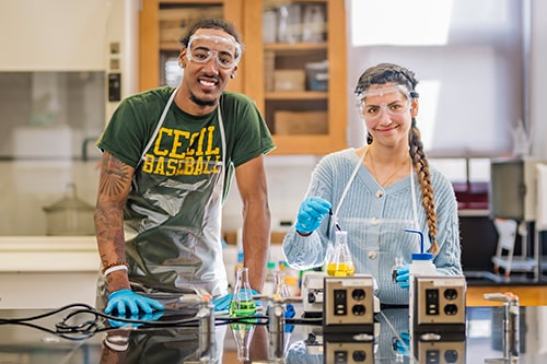 Two students in a science lab.