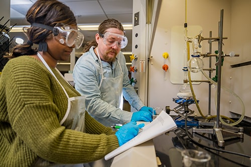 Two students in a science lab.