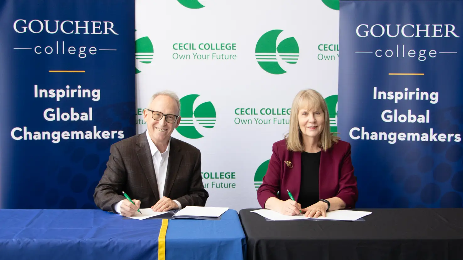 Goucher College President Dr. Kent Devereaux and Cecil College President Dr. Mary Way Bolt sign a formal articulation agreement to make the transfer process smoother.
