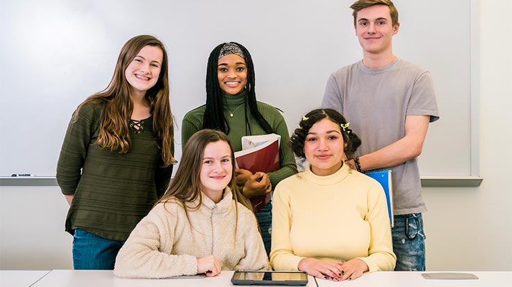 A group of high school students in a classroom.