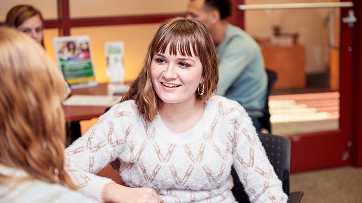 A student speaking with an admissions officer.