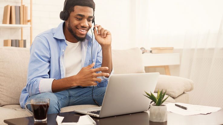 Student at home using a laptop.