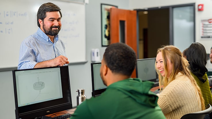 Students interacting with a teacher.