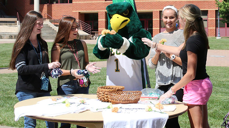 Gibson doing crafts with students.